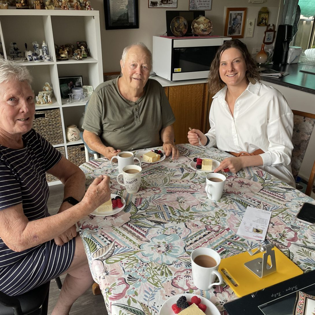 Diabetes SA - Three people smile at the camera, enjoying afternoon tea